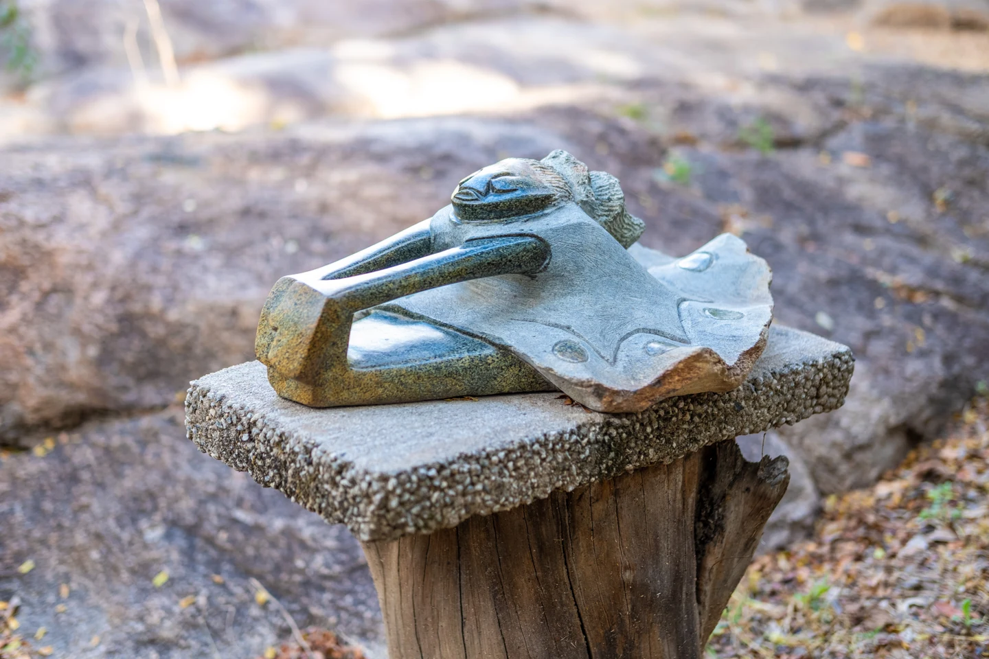 A reclining stone figure photographed outdoors